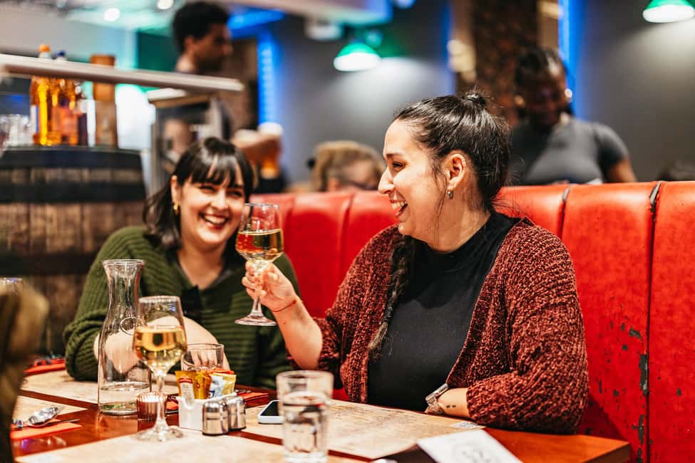 Edinburgh: Scottish Dinner and Folk Music Experience - Bagpipe Welcome Outside Biblos: Set Your Night in Motion